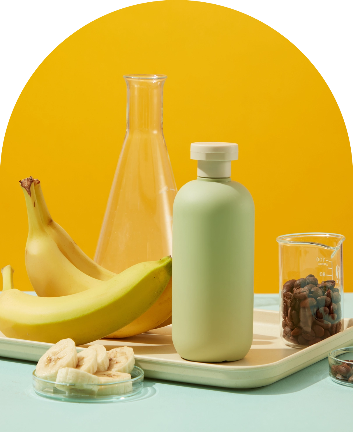 Bananas, bottle, and beakers on colorful background. Bananas, bottle, and beakers on colorful background.