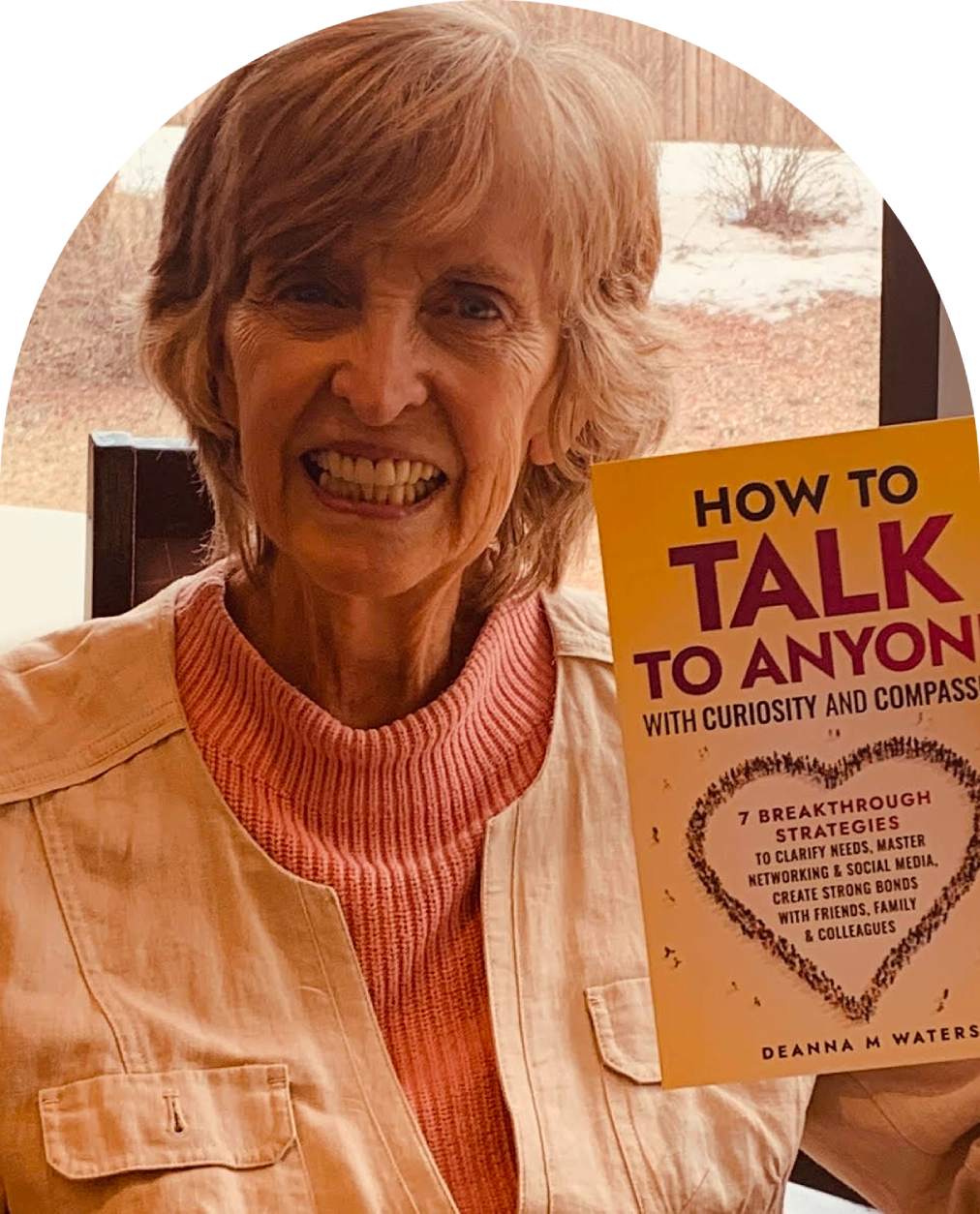 Person holding a book titled "How to Talk. Person holding a book titled "How to Talk.
