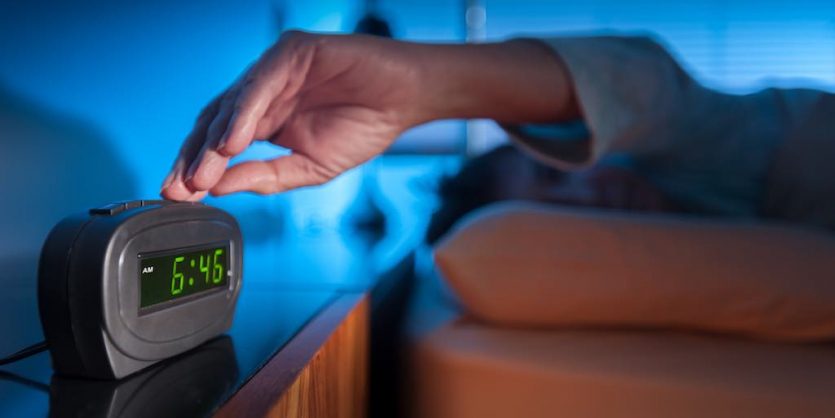 Snoozing-with-alarm-clock-AdobeStock_127628802-copy-835x418 Snoozing-with-alarm-clock-AdobeStock_127628802-copy-835x418